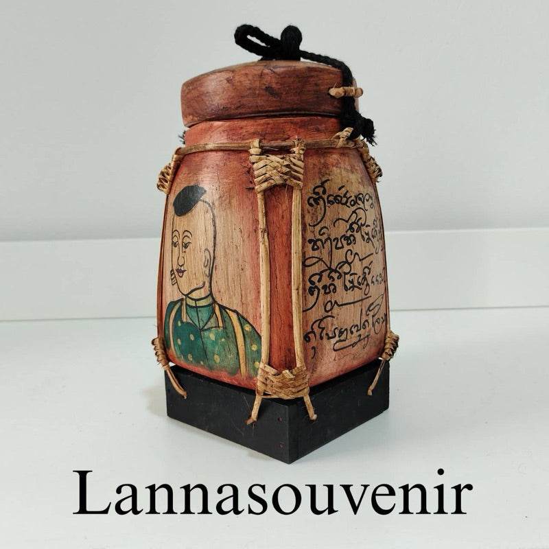 Traditional Lanna bamboo blessing box with painted monk and Thai script on wooden panels
