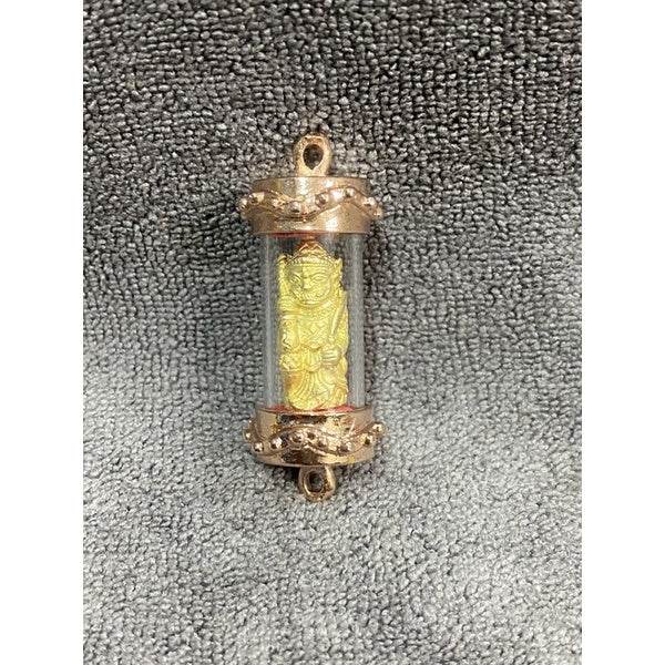 Lanna guardian wealth protection charm in a clear casing with golden figure inside