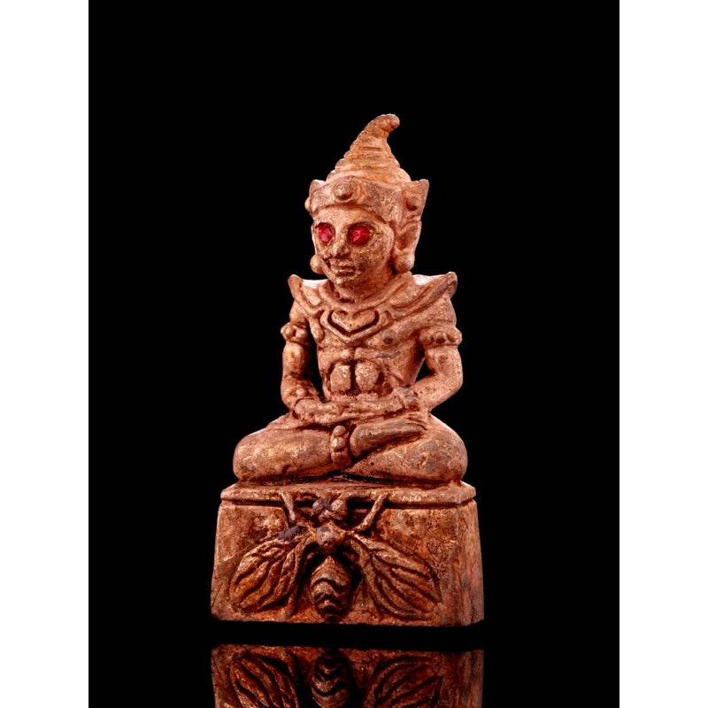 Lanna sorcery amulet for charm, intricately carved deity figure with red accents for good fortune