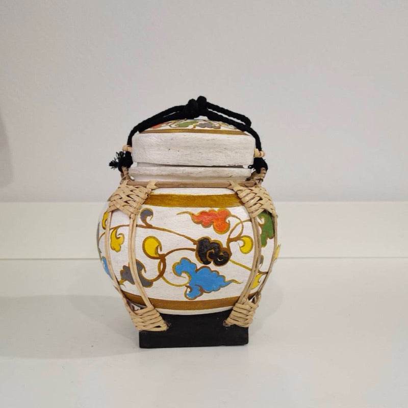 Handmade bamboo rice box with colorful floral patterns and black rope handle by One-Sake.com