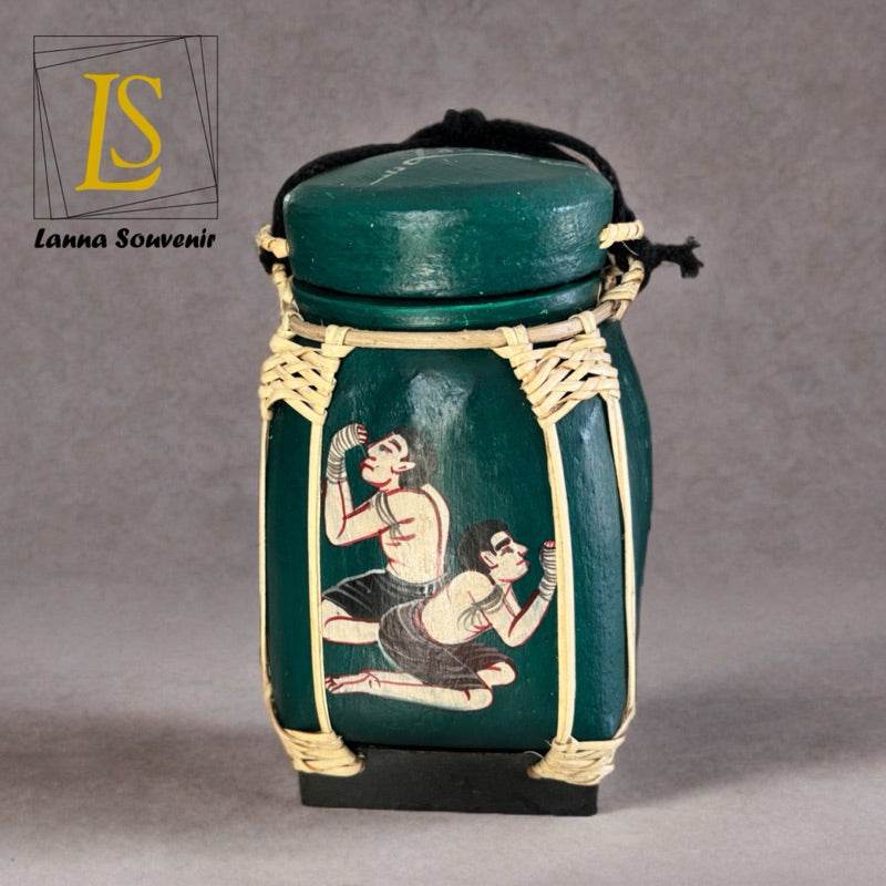 Handmade Thai decorative jar in dark green with traditional dancer artwork and woven accents