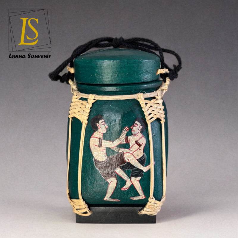 Handmade Thai decorative jar with green body and traditional boxing figure design