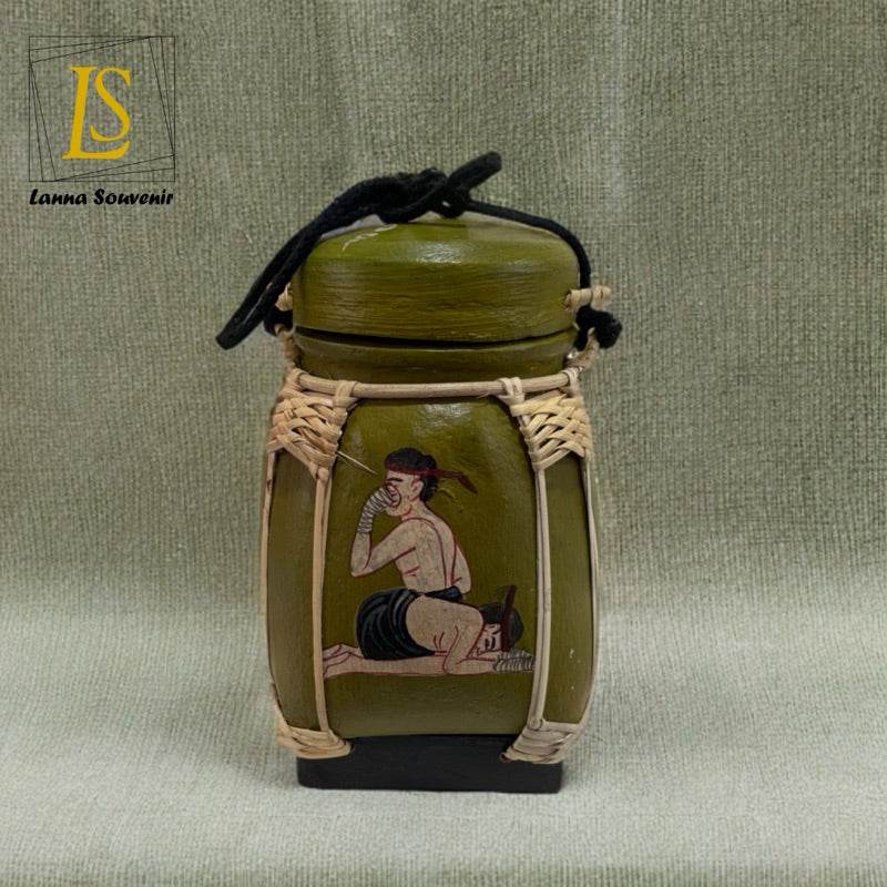 Handmade Thai decorative jar with traditional painting and woven rattan accents