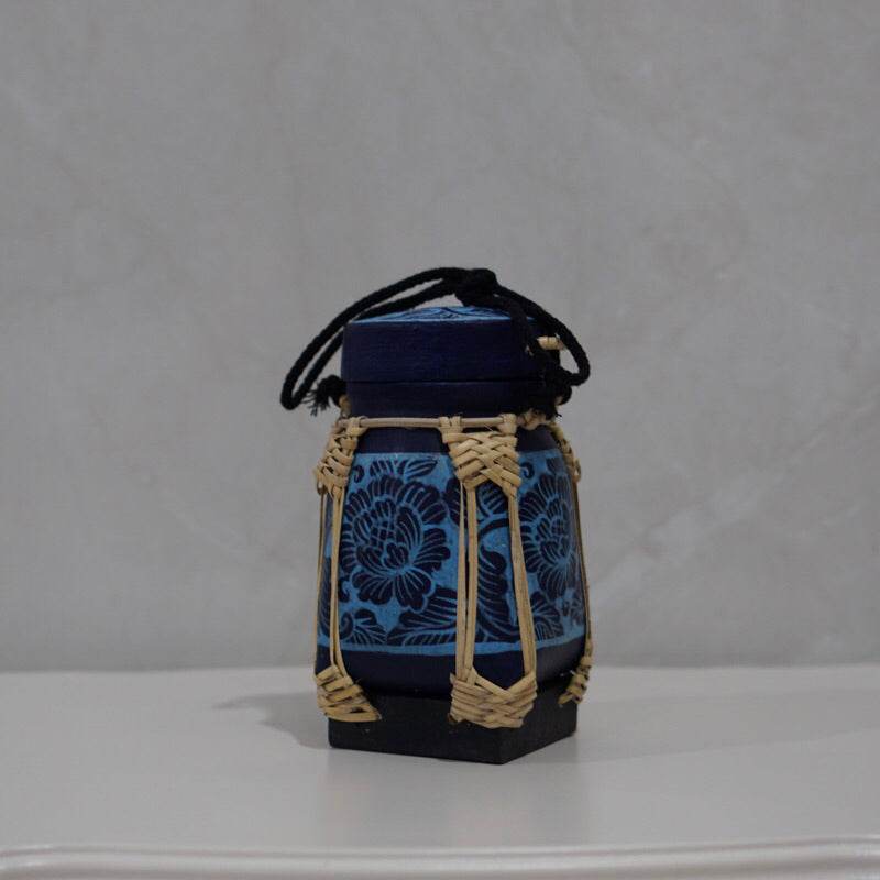 Handmade Thai rice basket with blue floral fabric and woven natural fiber details by One-Sake.com