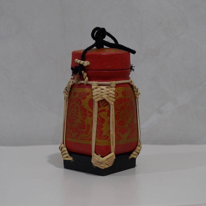 Handmade Thai rice basket with red and natural woven design and black base from One-Sake.com