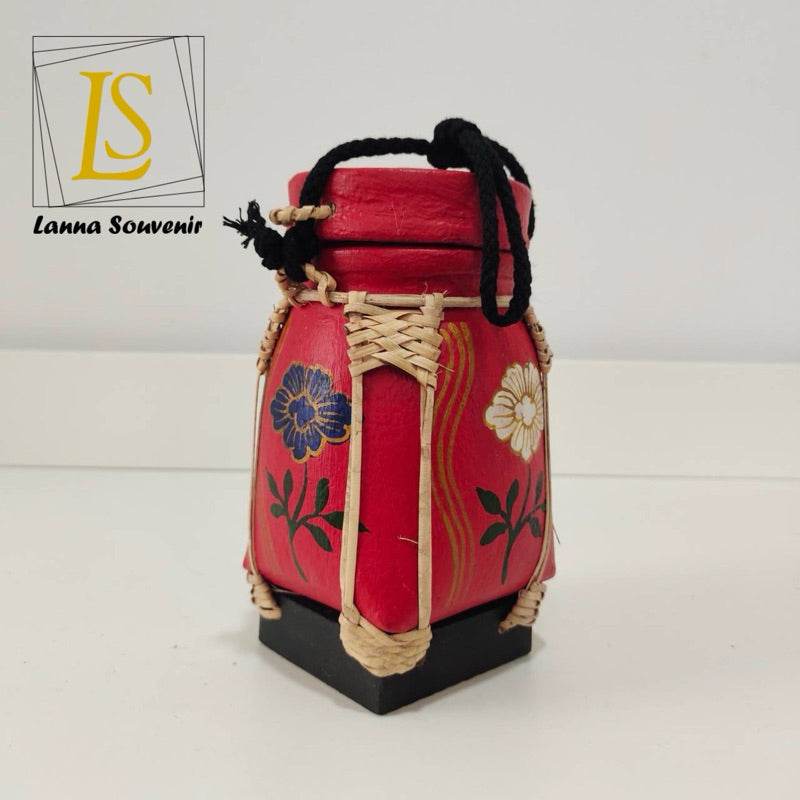 Handmade Thai rice basket in red with floral designs and black base for home decor