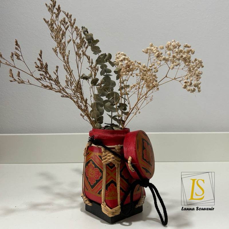 Handmade Thai rice basket with dried flowers and intricate red and black design by One-Sake.com