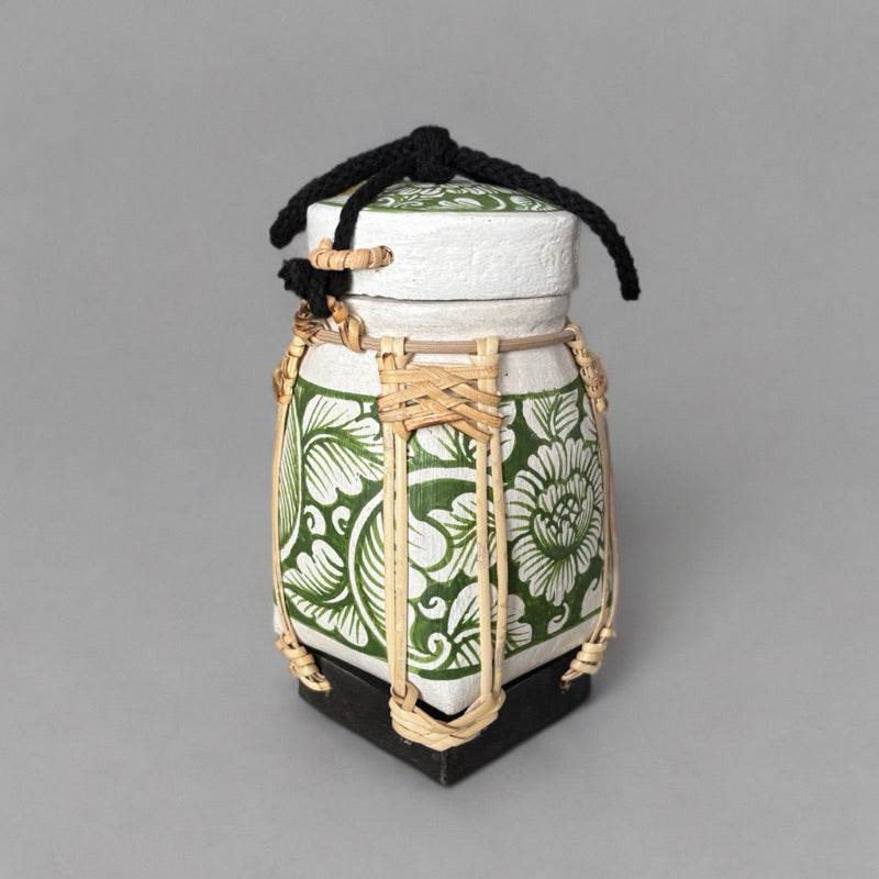 Handmade Thai rice basket from One-Sake.com with green floral patterns and woven details