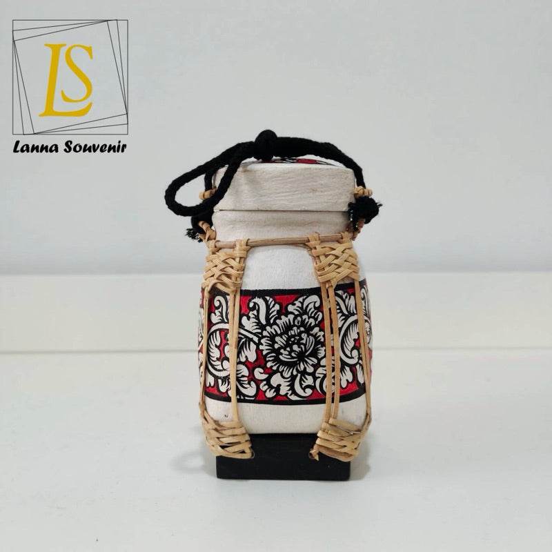 Handmade Thai rice basket with intricate woven design and traditional floral pattern from One-Sake.com