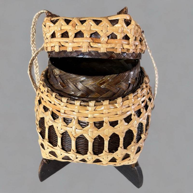 Bamboo sticky rice box from Thailand with intricate woven design and carrying handle