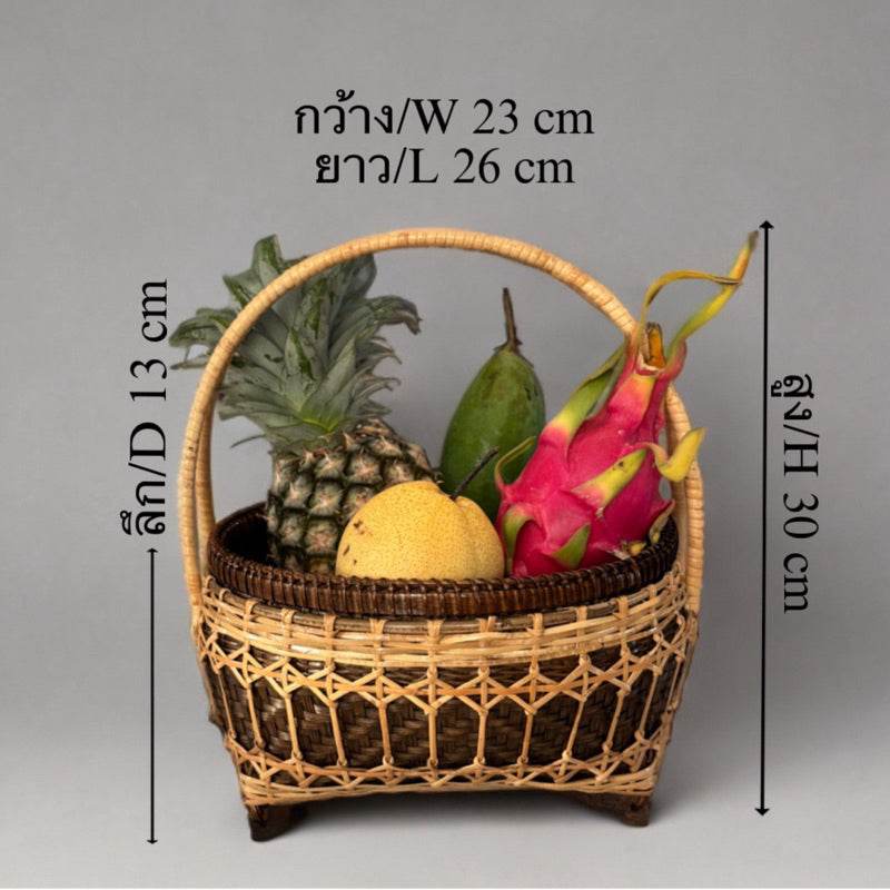 Handmade bamboo fruit basket with handle holding pineapple, dragon fruit, and other fruits