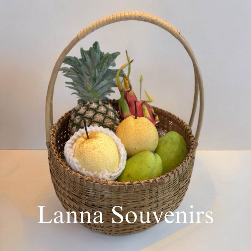 Handmade bamboo fruit basket filled with pineapple, dragon fruit, and mangoes from One-Sake.com