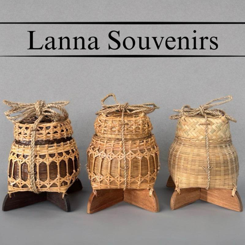 Three traditional Thai storage box souvenirs made of woven bamboo on wooden stands by One-Sake.com