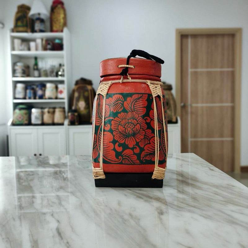 Lanna storage jar with floral pattern displayed on marble countertop in kitchen setting