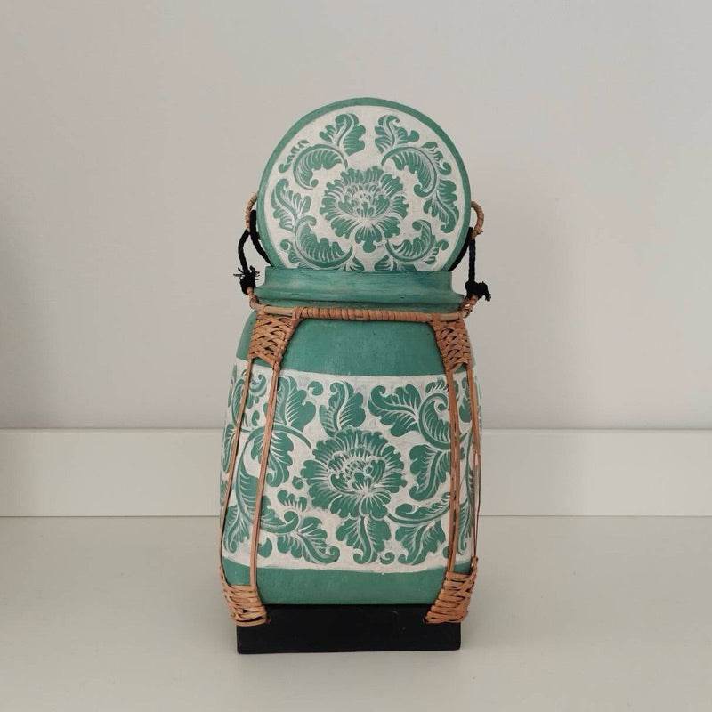 Lanna storage jar with floral pattern in green and white with woven rattan details for kitchen storage