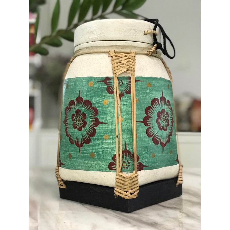 Lanna storage jar with floral pattern featuring woven handles and a green decorative band