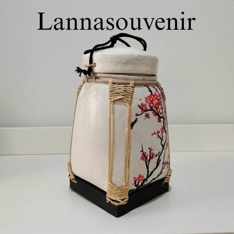 Lanna storage jar with floral pattern featuring pink blossoms and bamboo accents for kitchen storage
