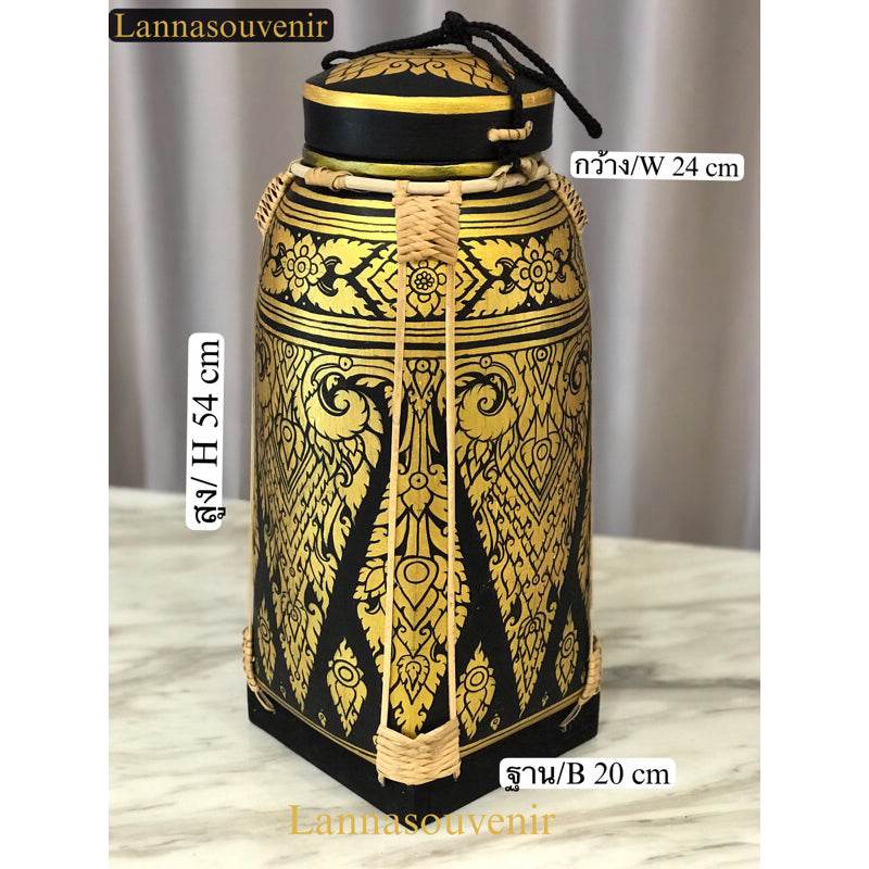Lanna style bamboo rice box decorated with intricate traditional patterns in black and gold