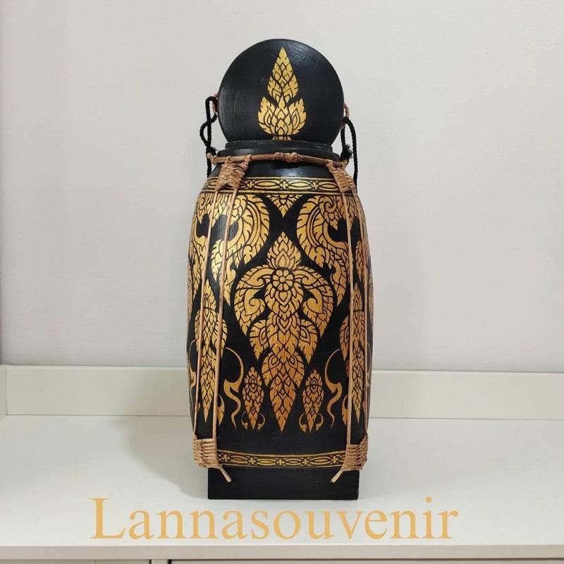 Lanna style bamboo rice box with traditional golden black patterns and woven details