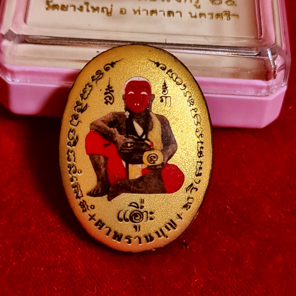 Locket Ta Pran Boon golden back with sacred inscriptions and figure from Thai Blessing Co