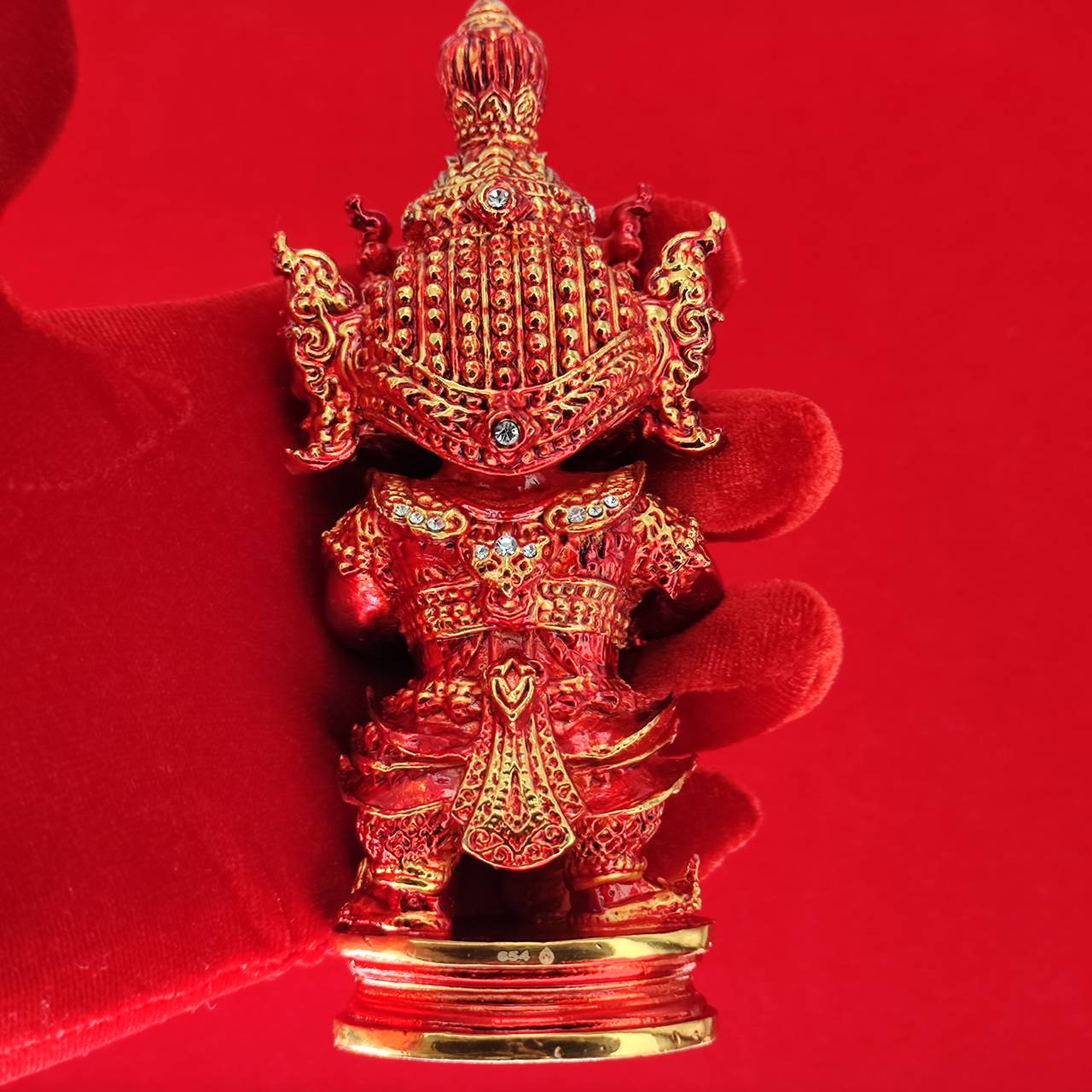 Lord Vesuvanna lucky charm figurine in red with intricate details and ornate decorations for good fortune