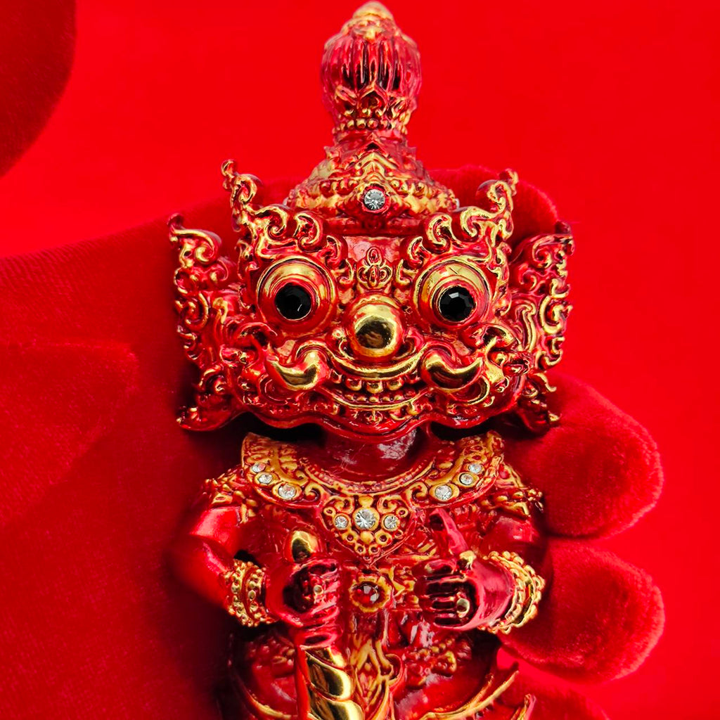 Lord Vesuvanna lucky charm figurine in vibrant red with intricate details and decorative accents