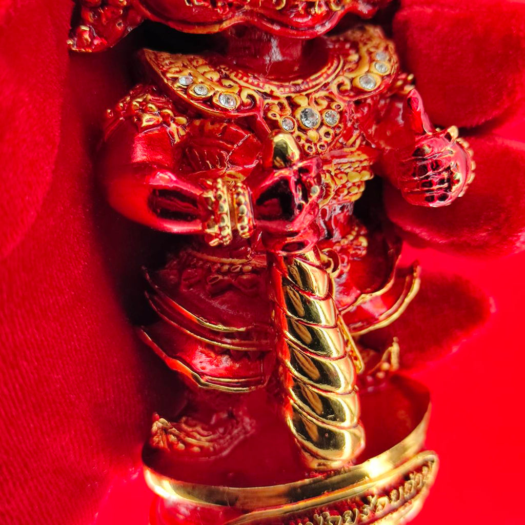 Lord Vesuvanna lucky charm figurine in red with golden accents, perfect for home decor and spiritual blessings