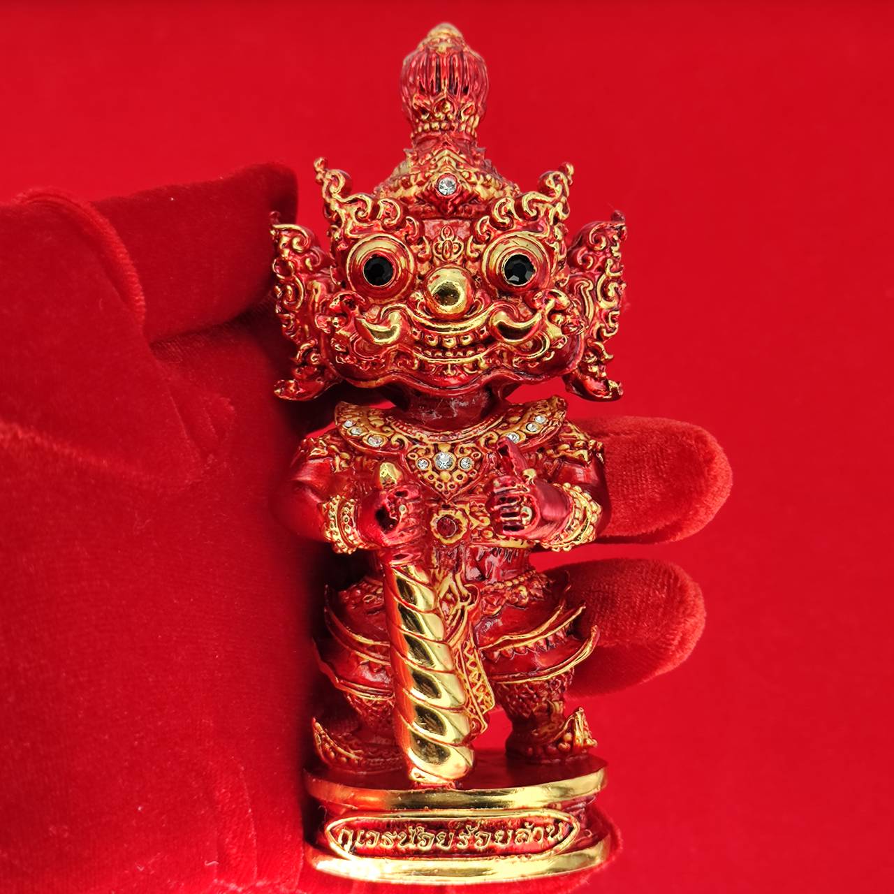 Handcrafted Lord Vesuvanna lucky charm figurine in vibrant red with intricate details