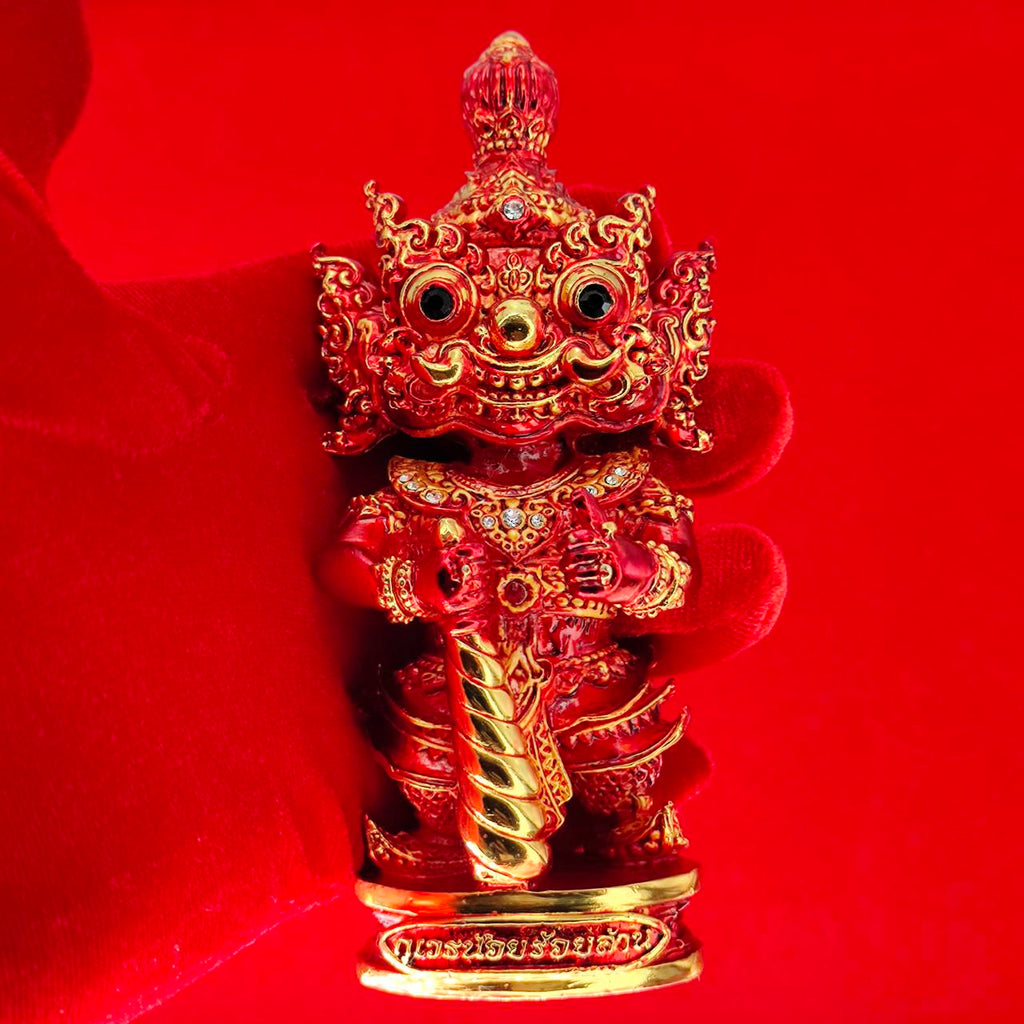 Lord Vesuvanna lucky charm figurine in vibrant red with intricate details and decorative embellishments