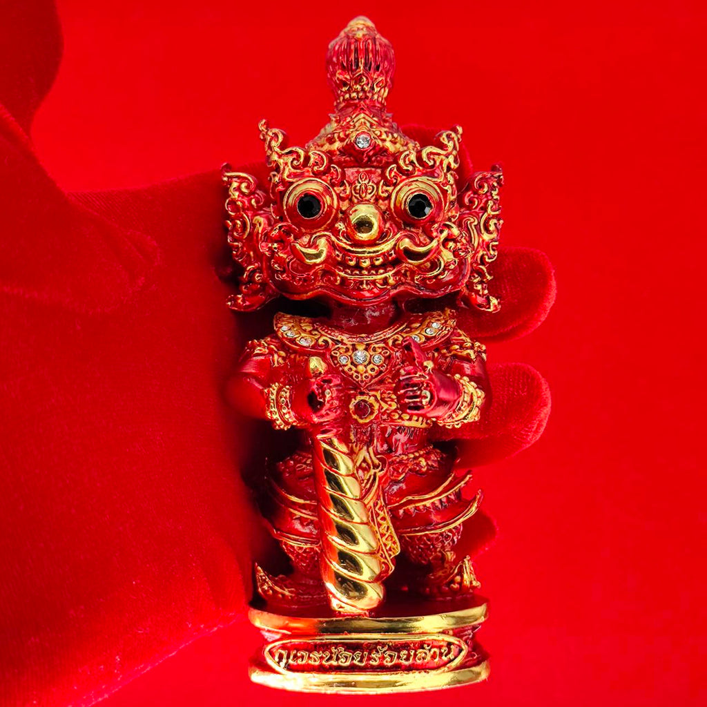 Lord Vesuvanna lucky charm figurine in vibrant red with intricate gold detailing for home decor