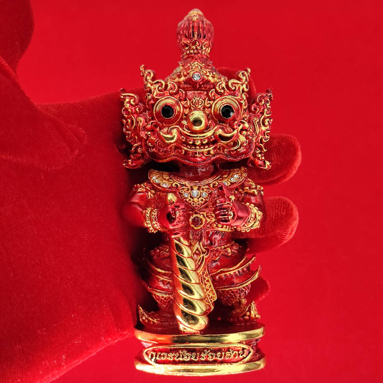 Lord Vesuvanna lucky charm figurine in vibrant red with intricate gold detailing for home decor