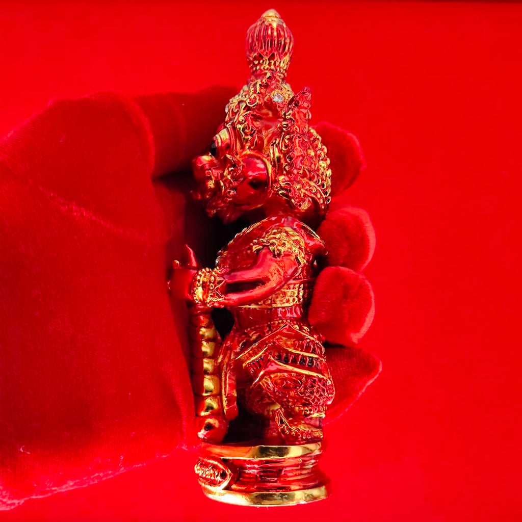 Lord Vesuvanna lucky charm figurine in red, showcasing intricate details and craftsmanship for home decor