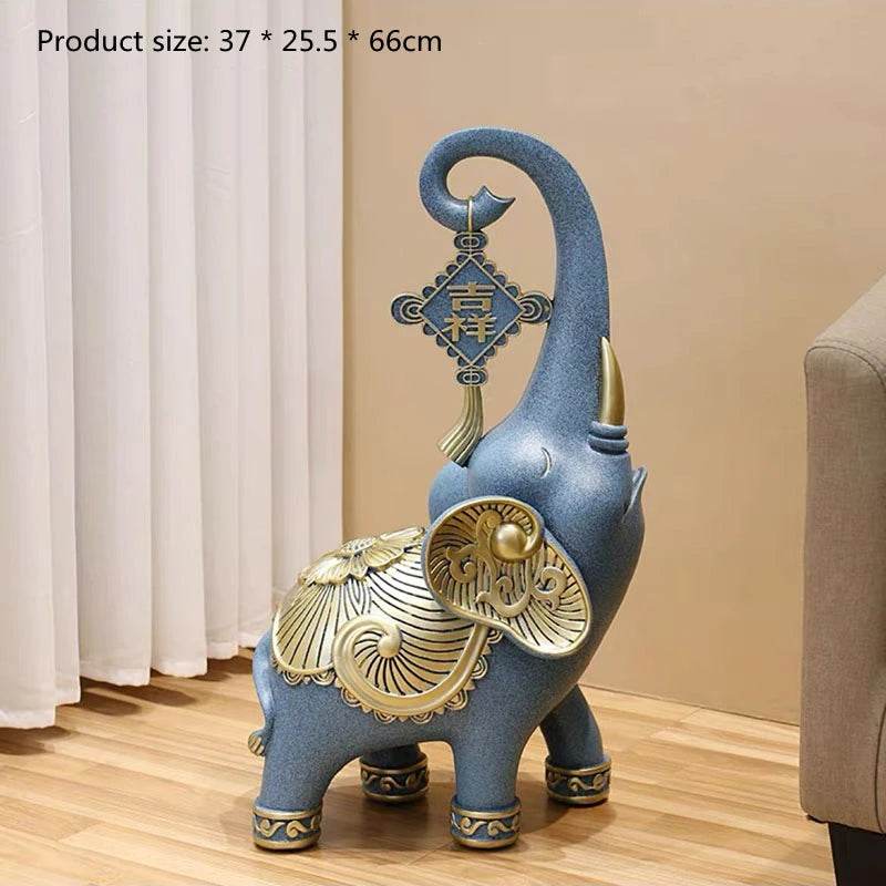 Ornate blue and gold ceramic elephant tray for keys and jewelry with hanging charm and decorative saddle