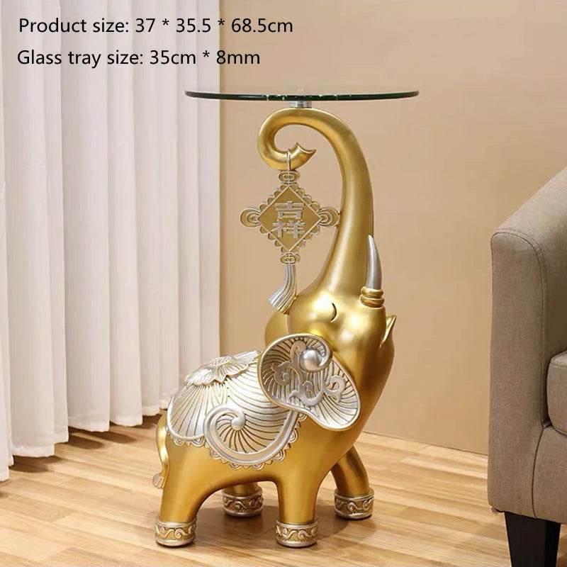 Gold decorative elephant side table with glass top and ornate silver accents elephant tray for keys and jewelry