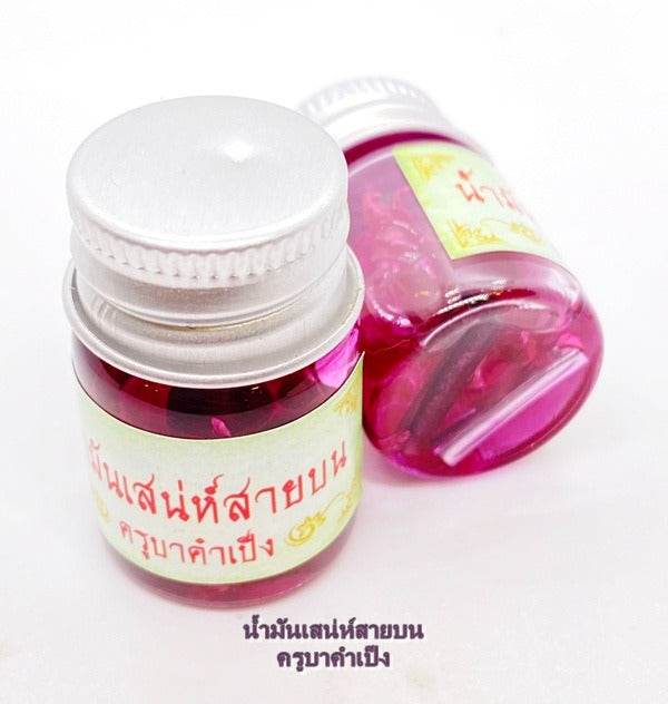 Maha Laluay spiritual attraction oil in pink glass bottles for enhancing positive energy and attraction