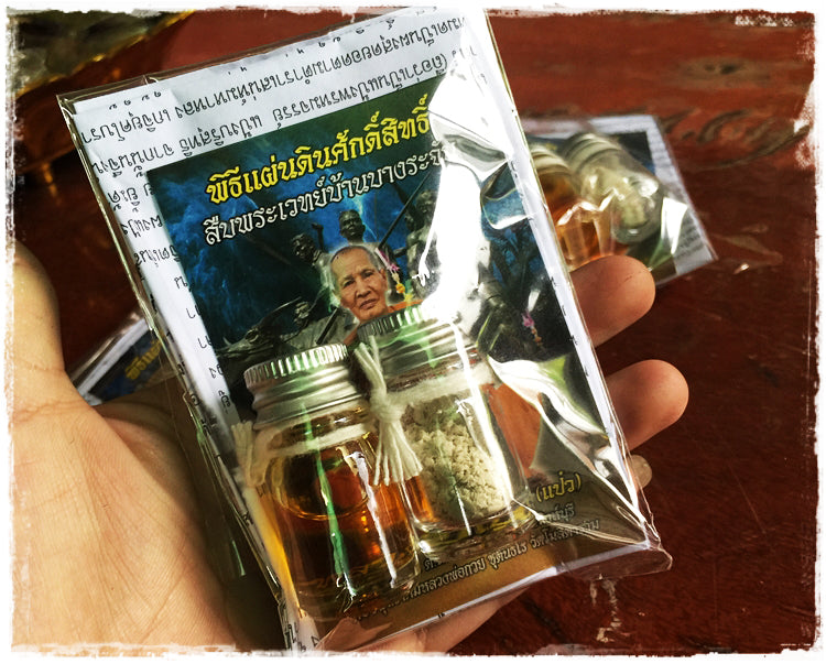 Maha Long Charm Oil and Aok Tak Powder pack featuring traditional Thai herbal amulets in small jars