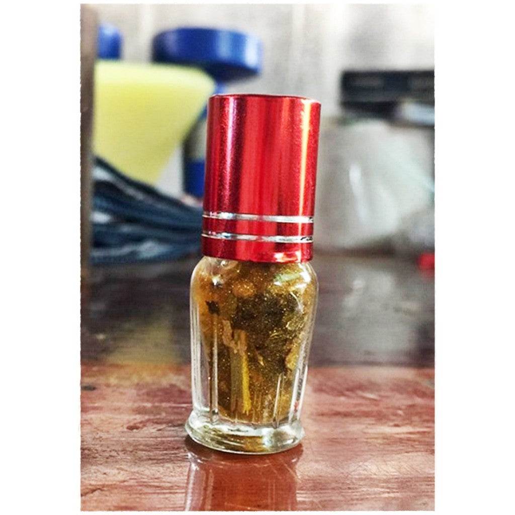 Maha Phokasap oil for luck and wealth in a small glass bottle with a red cap from Thai Blessing Co