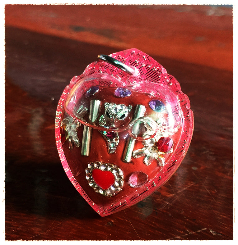 Thai amulet for love and fortune red heart charm in pink resin case with silver charms and rhinestones