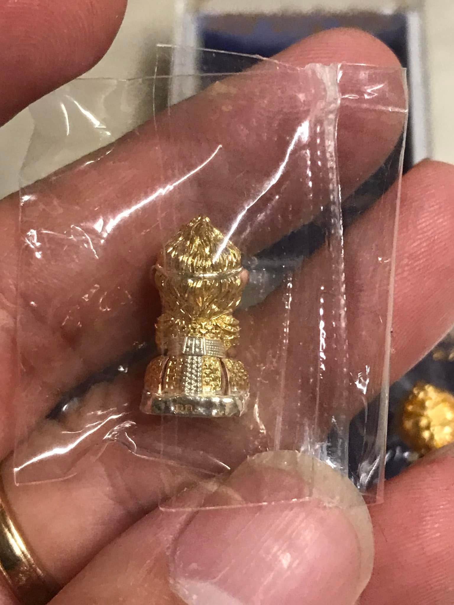 Monkey King fortune amulet in gold finish, held in hand, perfect for enhancing luck and prosperity