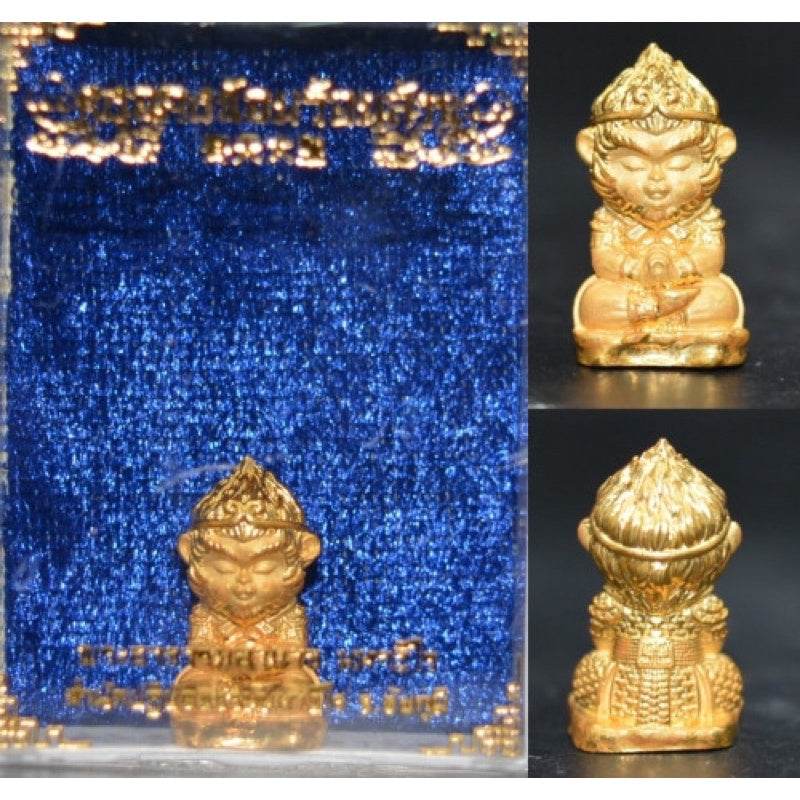 Monkey King fortune amulet in gold with blue backdrop for prosperity and protection