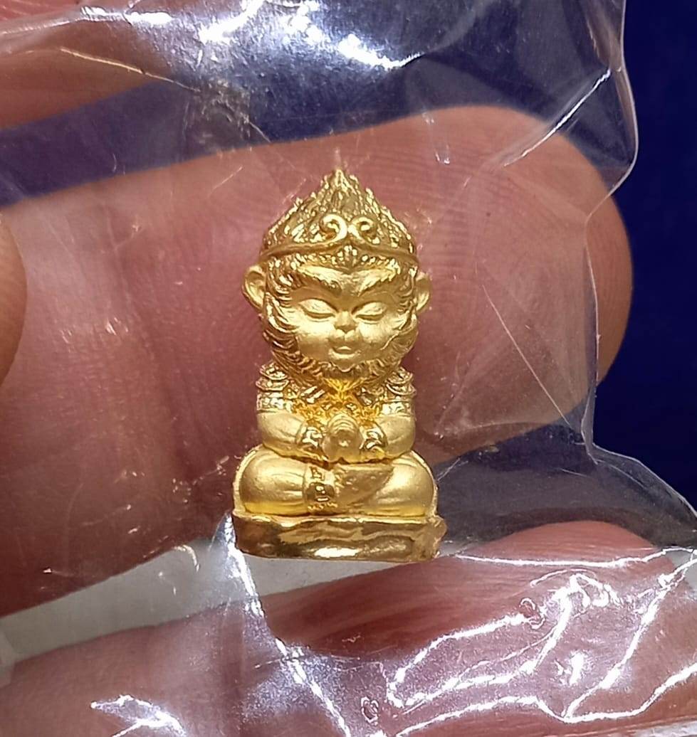 Golden Monkey King fortune amulet in a protective pouch, ideal for enhancing luck and prosperity.
