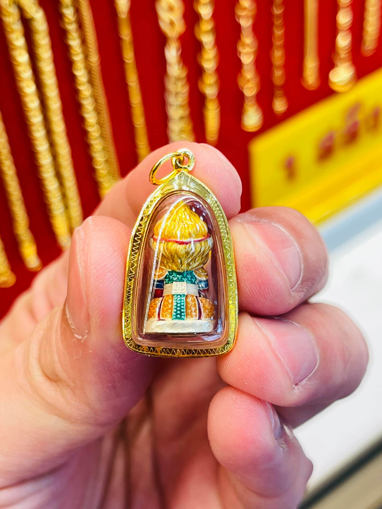 Monkey King fortune amulet crafted in gold with detailed design for prosperity and protection