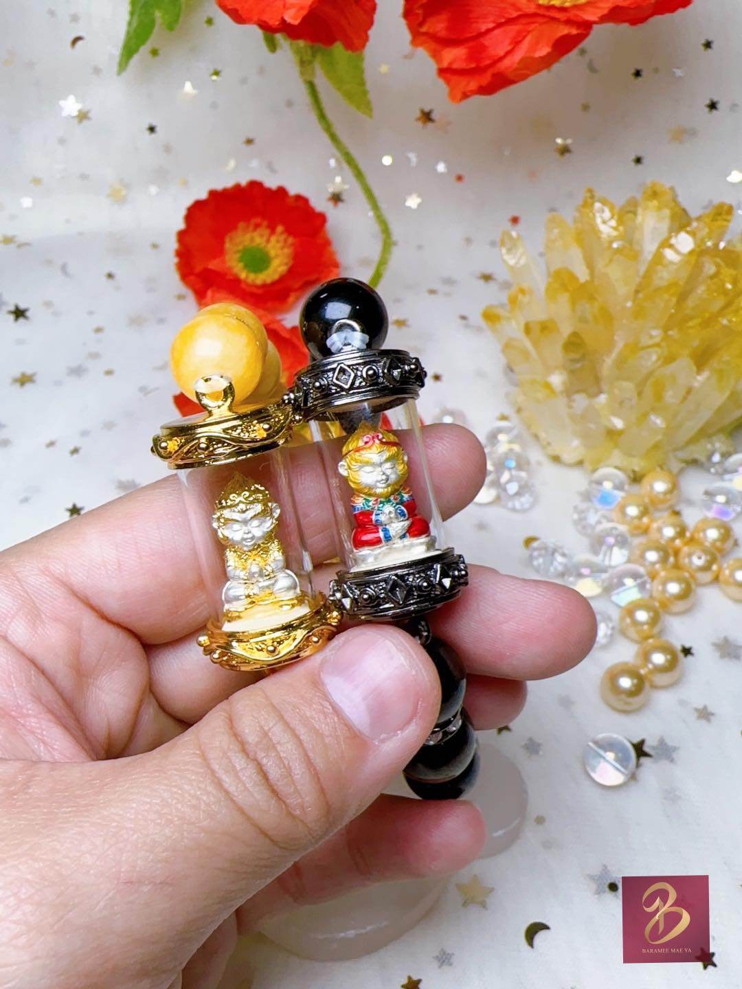 Handcrafted Monkey King fortune amulet with golden figures, perfect for Feng Shui enthusiasts