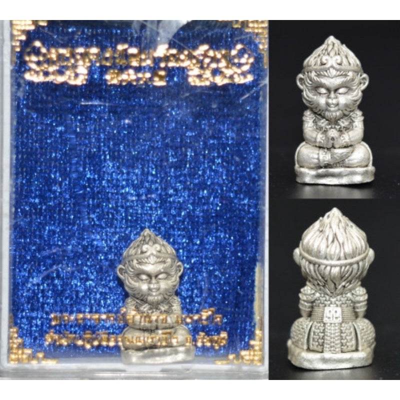 Monkey King fortune amulet statue in silver with detailed features and decorative background