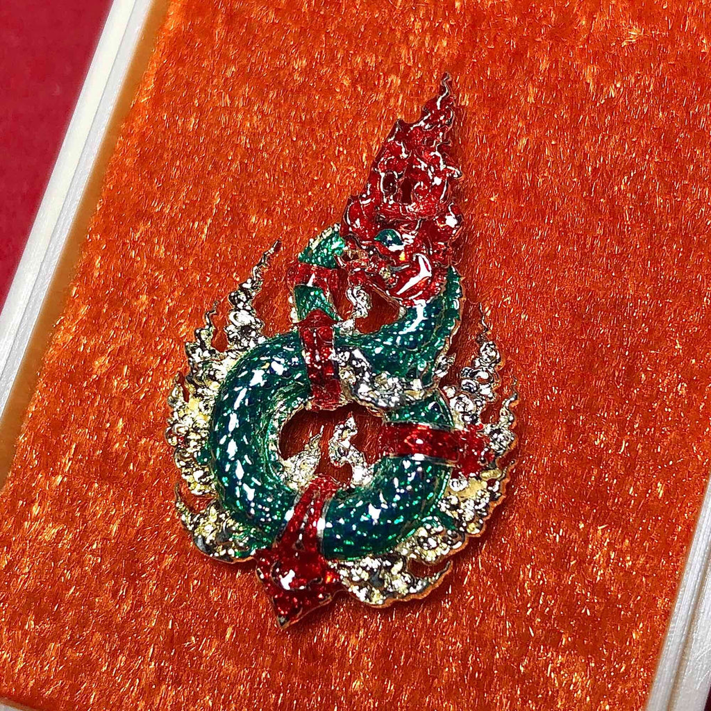 Naga amulet for wealth and protection in intricate design with vibrant colors and detailed craftsmanship