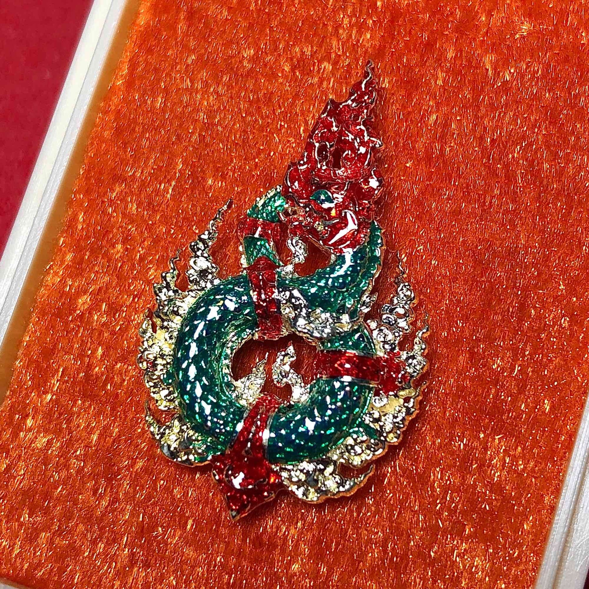 Naga amulet for wealth and protection in intricate design with vibrant colors and detailed craftsmanship