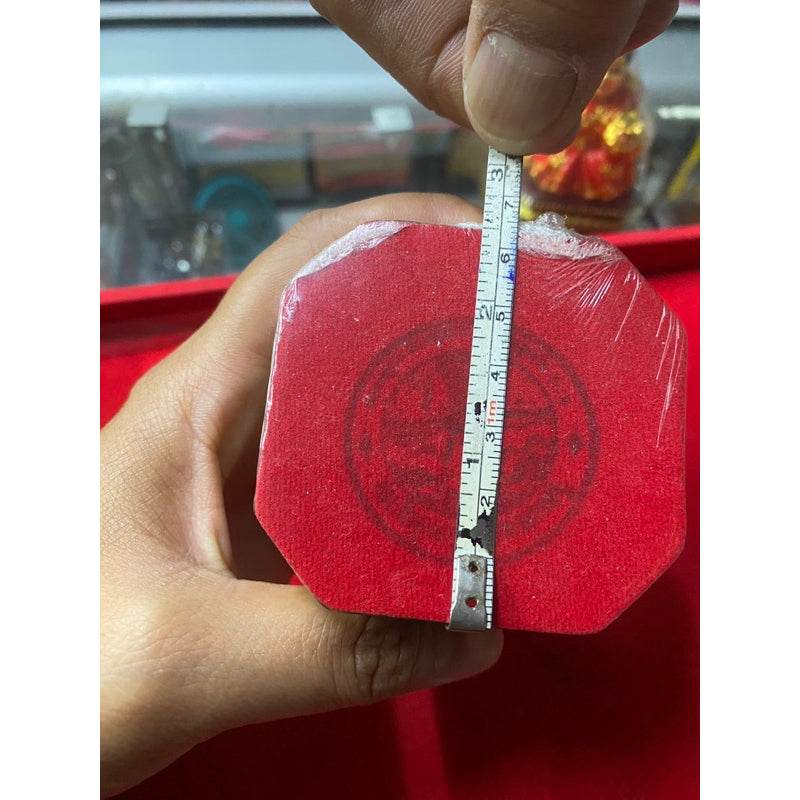 Nang Rap Maha Lap Sap Sombun for prosperity shown being measured for size and authenticity