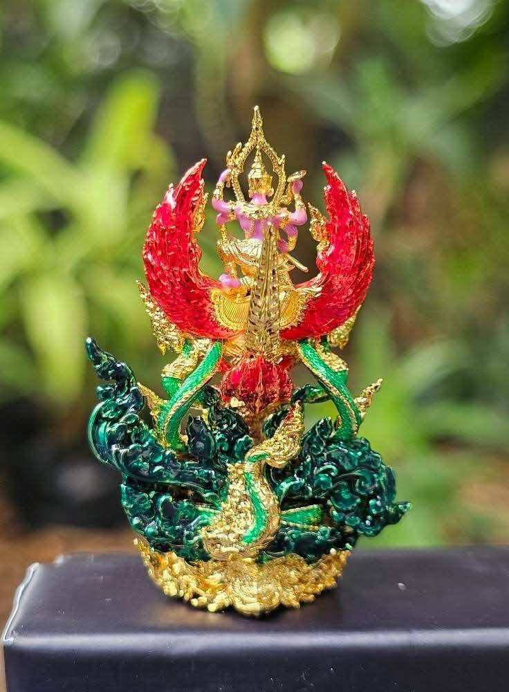 Narayana on Garuda amulet with vibrant colors depicting a divine figure and intricate details
