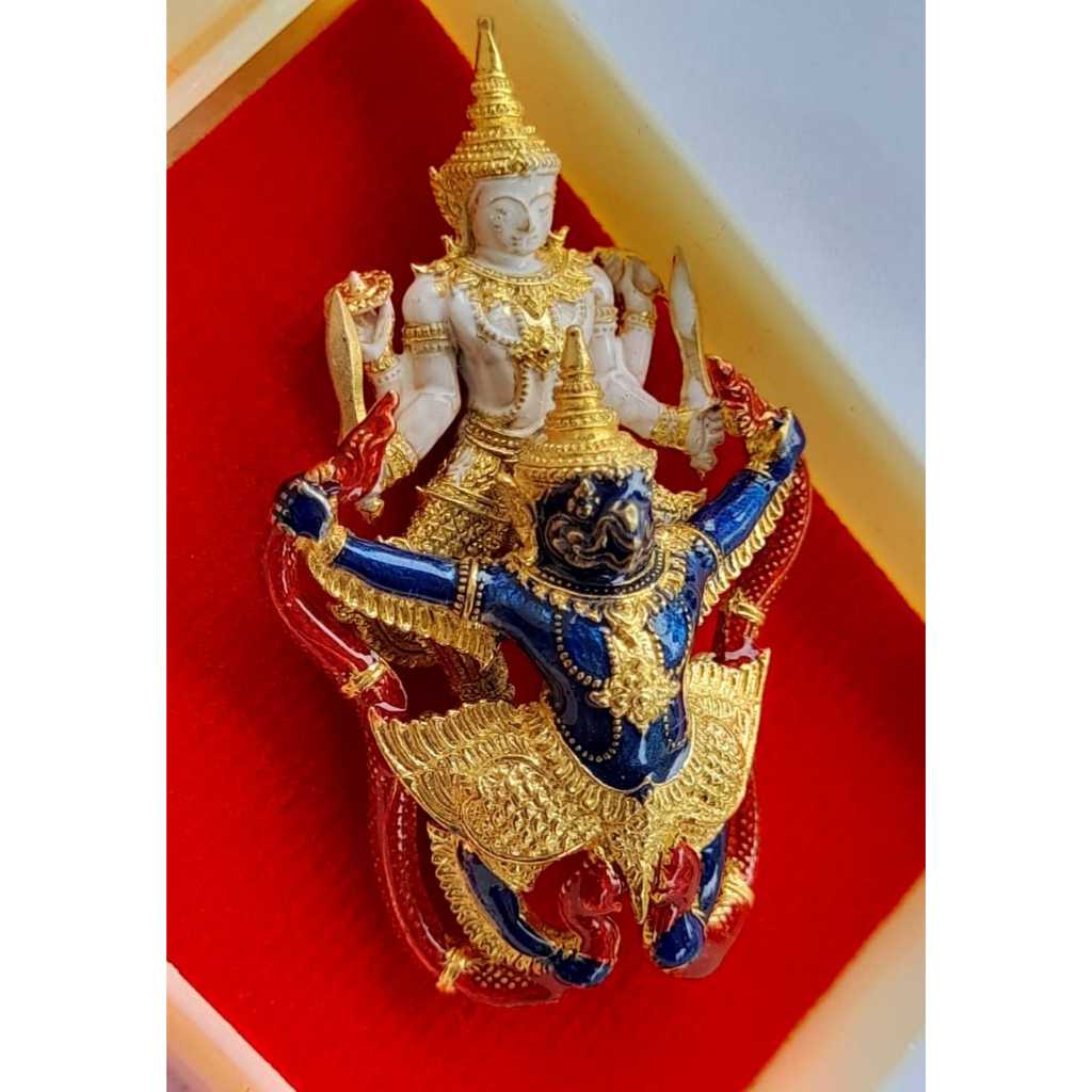 Narayana on Garuda amulet with intricate gold and blue detailing on red background by Thai Blessing Co
