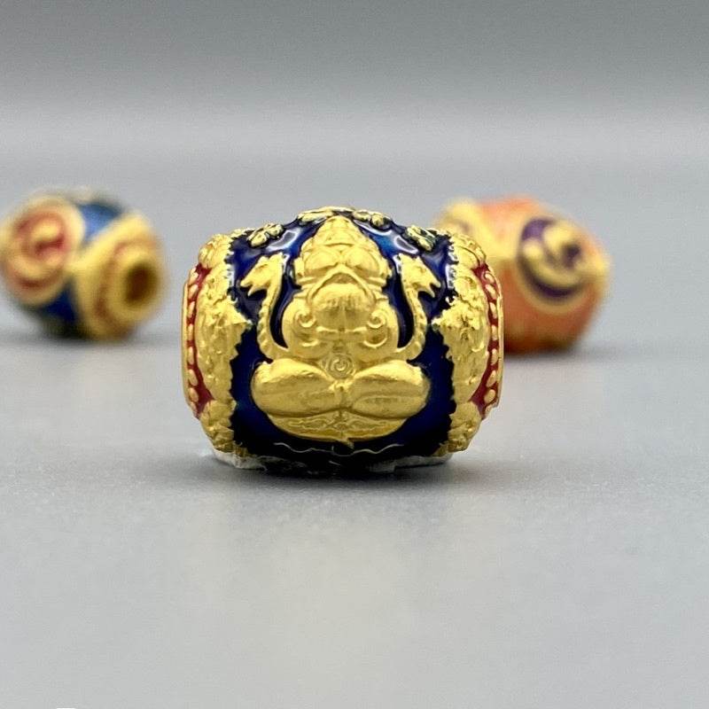Blue and gold enamel bead charm embossed with meditating figure for bracelet Billionaire Prosperity Thai amulet
